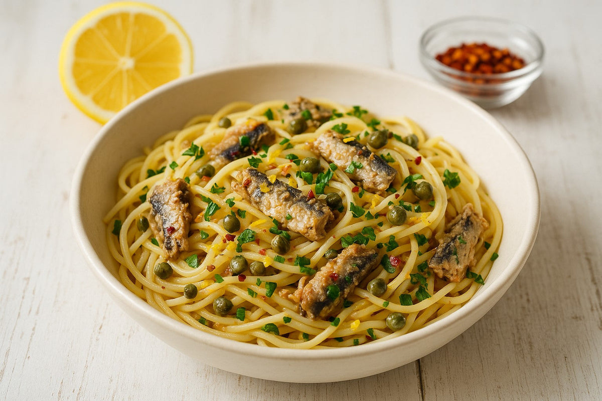Spaghetti with Portuguese sardines, lemon and capers in a pan